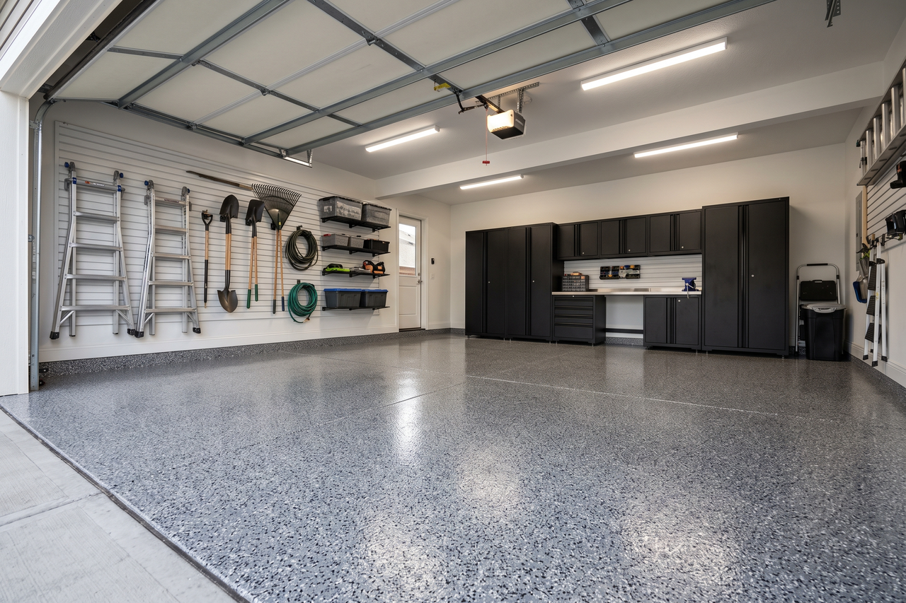 Gray flake epoxy garage floor with a clean, sealed finish